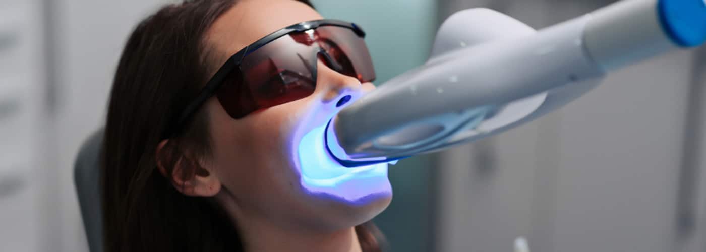 Woman Receiving Teeth Whitening Procedure — Your Holistic Dentists in Casuarina, NSW