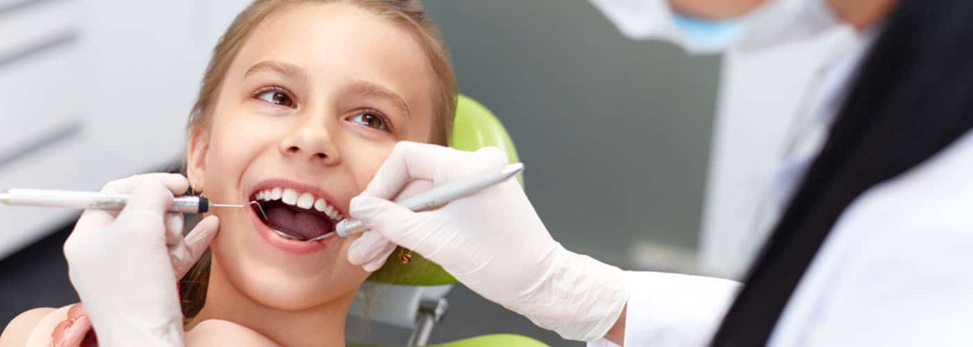 Dentist Examining Girls Teeth — Your Holistic Dentists in Casuarina, NSW