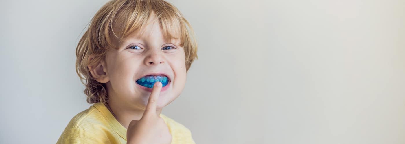 Little Boy Showing His Myobrace — Your Holistic Dentists in Casuarina, NSW