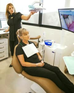 Dentist Showing An Image To The Patient