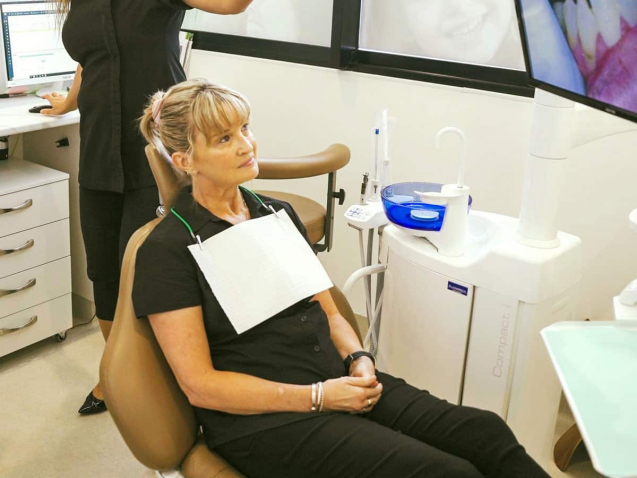 Dentist Showing An Image To The Patient