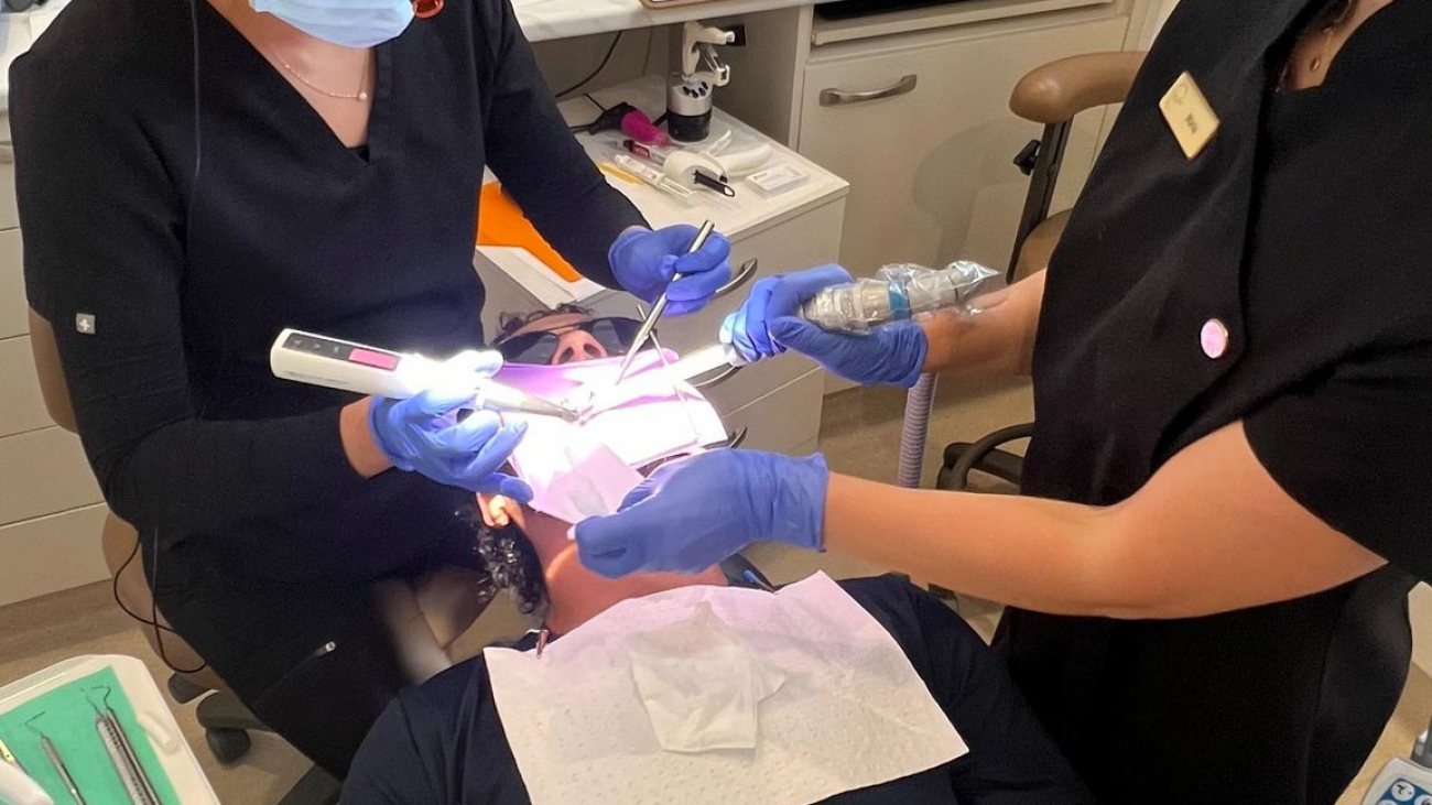 Emergency Dentist Taking Care Of A Patient