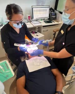 Emergency Dentist Taking Care Of A Patient