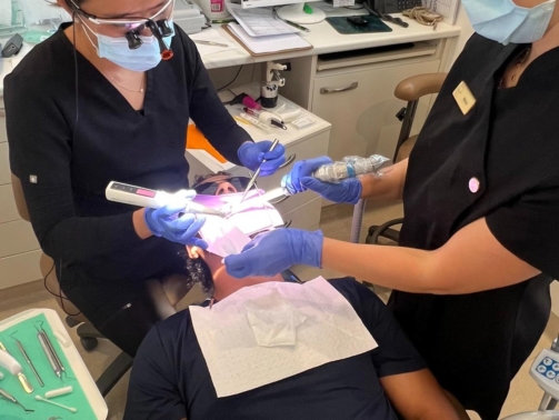Emergency Dentist Taking Care Of A Patient