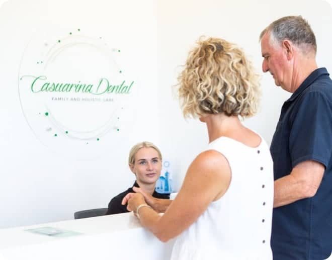 Patients Talking to Receptionist — Your Holistic Dentists in Casuarina, NSW
