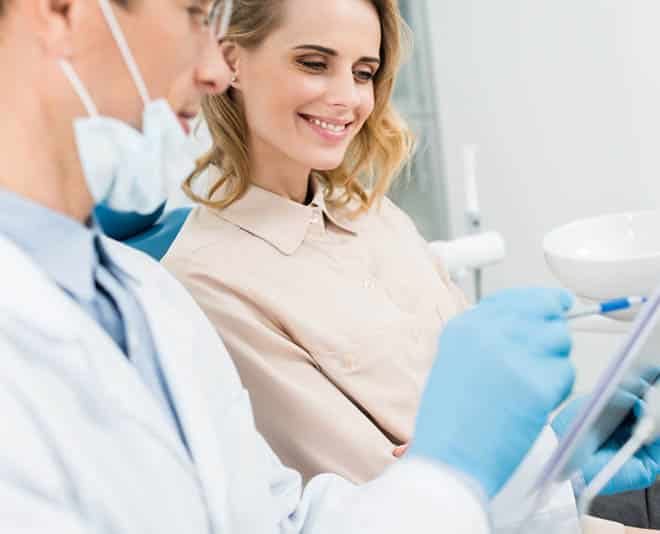 Dentist Reading the Result to Patient — Your Holistic Dentists in Casuarina, NSW