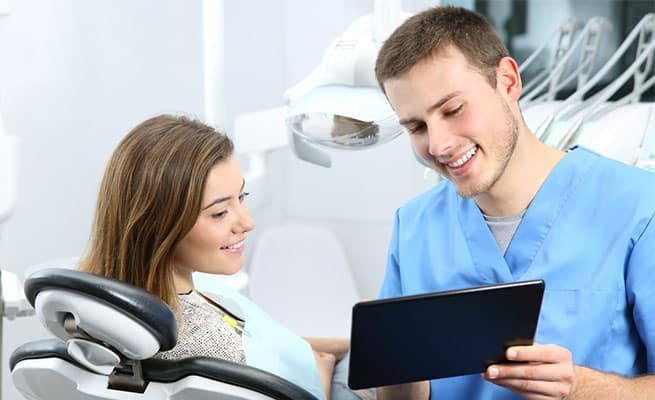 Dentist Using Tablet to Show Results — Your Holistic Dentists in Casuarina, NSW