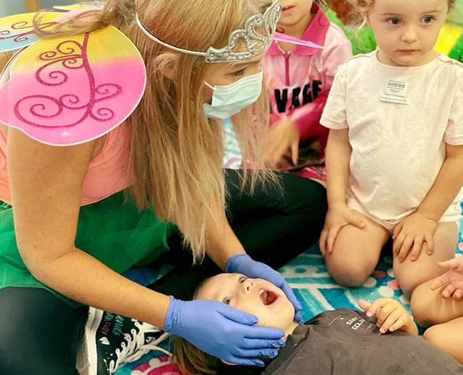 Dentist Wearing Costume Playing with Kids — Your Holistic Dentists in Casuarina, NSW