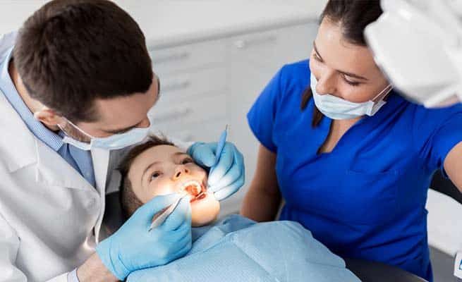 Dentist Checking Kid's Teeth — Your Holistic Dentists in Casuarina, NSW