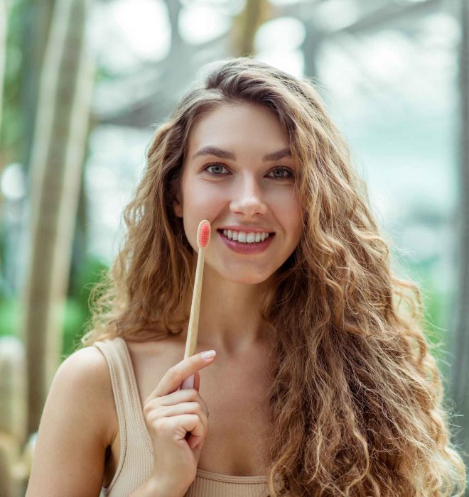 Girl with Bamboo Toothbrush — Your Holistic Dentists in Casuarina, NSW